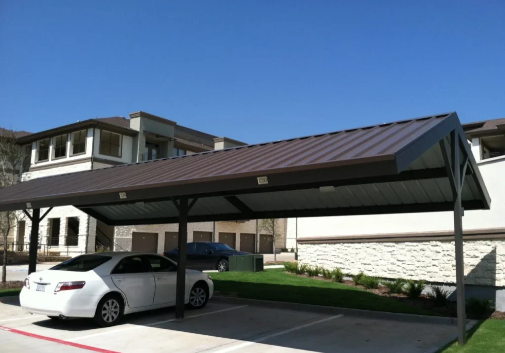 Carport with white car parked under it.